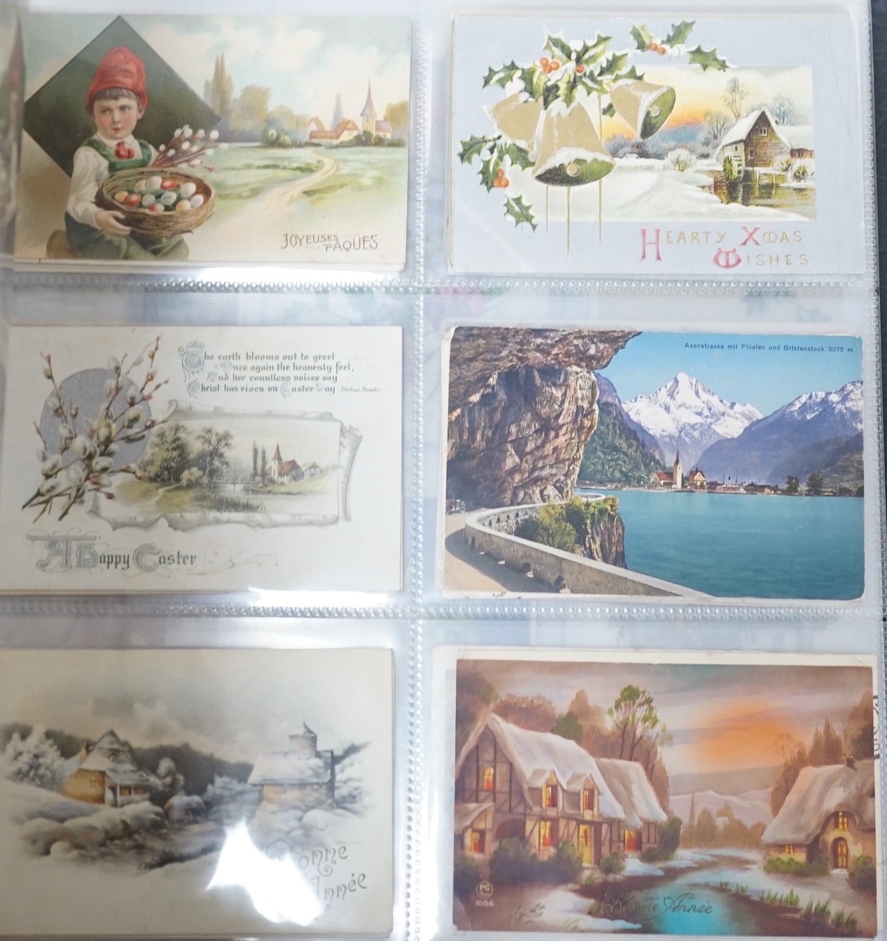 A selection of early 20th century postcards in an album, to include novelty, Christmas, Happy New Year, German, French, Paris, English locations, including Brighton, etc.